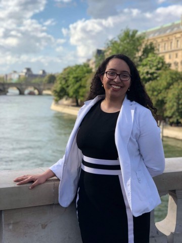 Jordan standing in front of a river